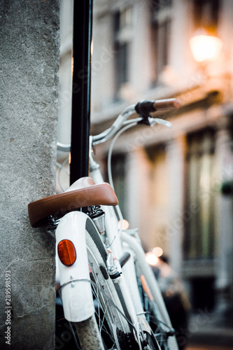 White bicycle parked on the sidewalk of Old Montreal