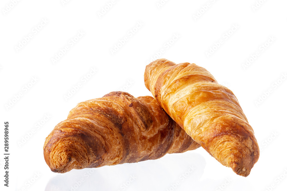 Two classic french croissant on a white background. Homemade baking. Two classic french croissant on a white background. Homemade baking.