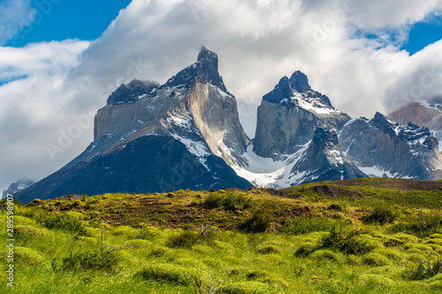 The Andes mountain range peaks of the Cuernos del Paine in their full glory inside the Torres del Paine national park near Puerto Natales, Patagonia, Chile. photo