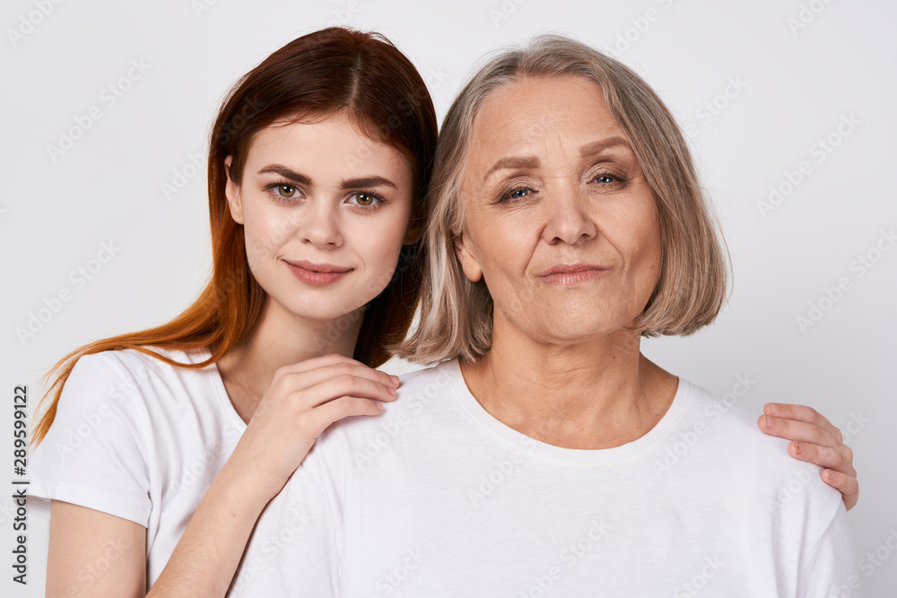 portrait of mother and daughter isolated on white