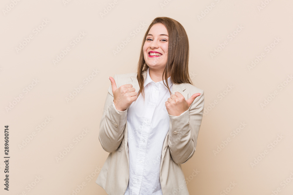 Young business woman raising both thumbs up, smiling and confident. Young business woman raising both thumbs up, smiling and confident.