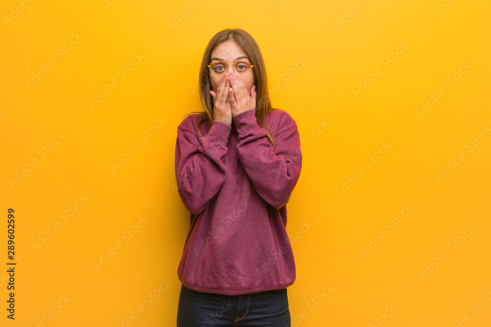 Young casual woman very scared and afraid hidden Young casual woman very scared and afraid hidden