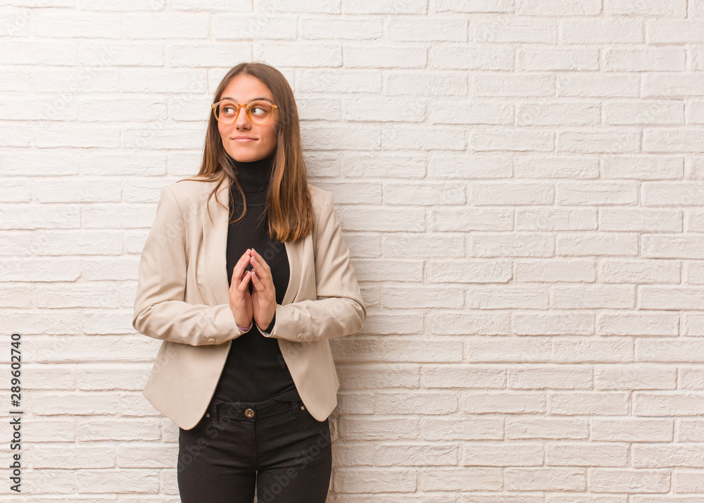 Young pretty business entrepreneur woman devising a plan Young pretty business entrepreneur woman devising a plan