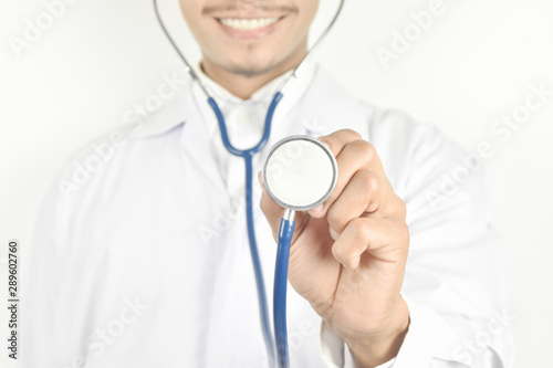 Doctor with a stethoscope in hands on white background.