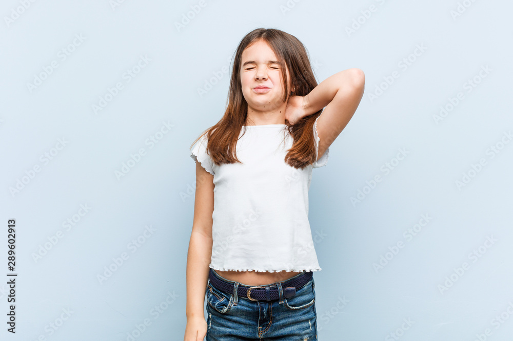 Cute girl suffering neck pain due to sedentary lifestyle. Cute girl suffering neck pain due to sedentary lifestyle.