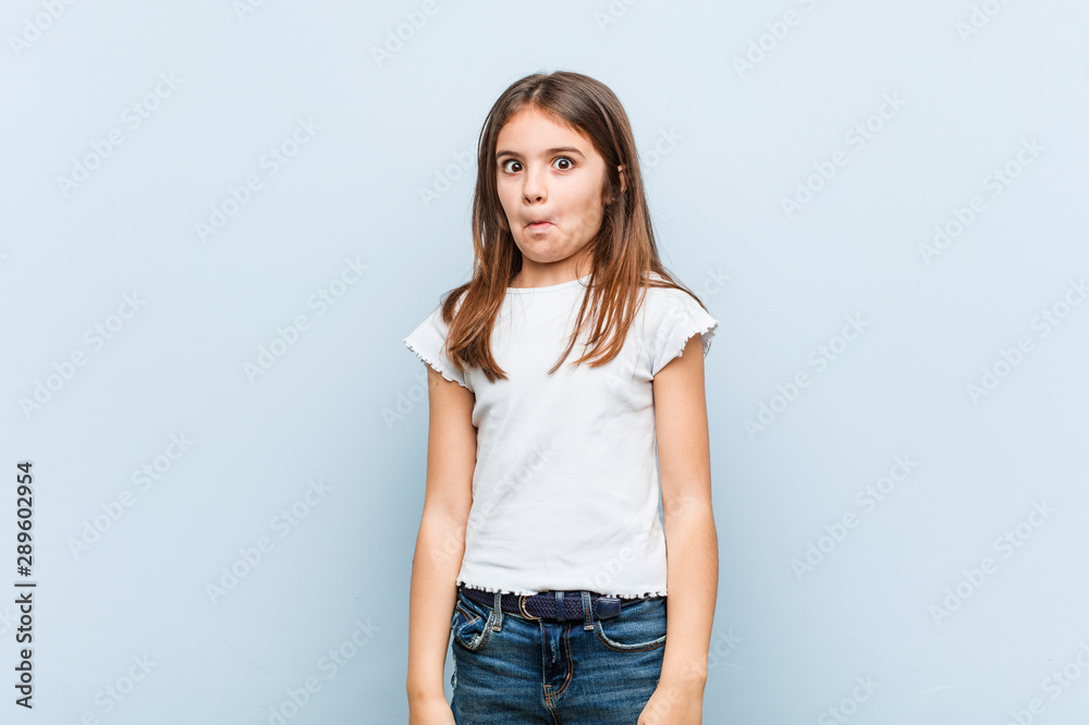 Cute girl shrugs shoulders and open eyes confused. Cute girl shrugs shoulders and open eyes confused.