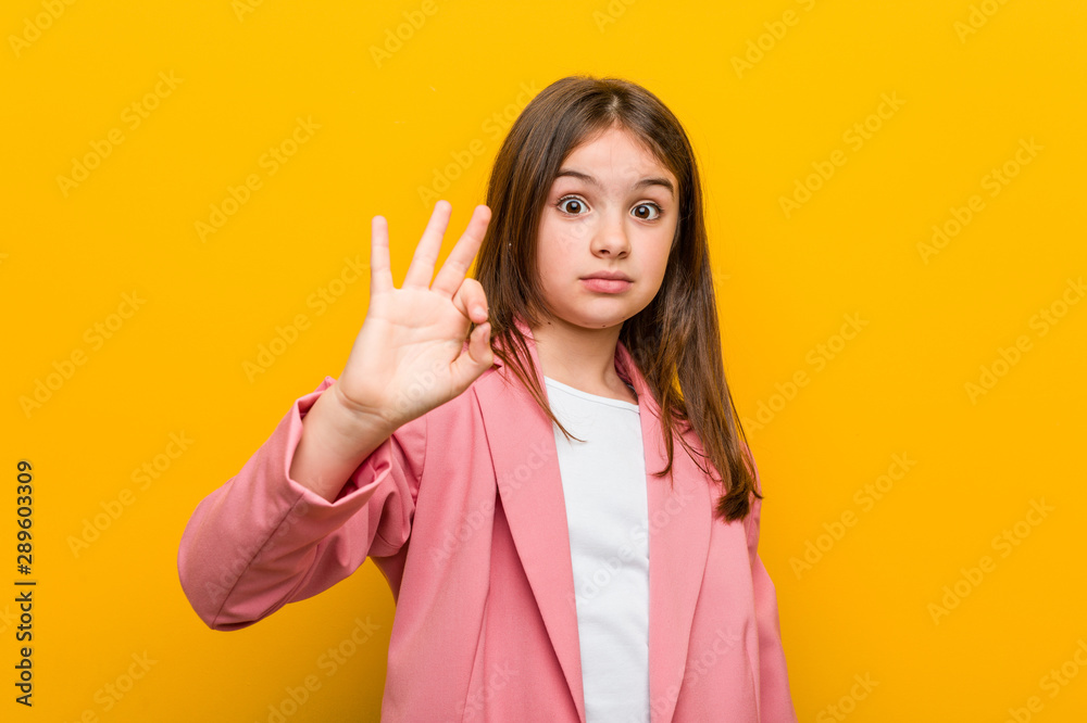 Little caucasian cute girl cheerful and confident showing ok gesture. Little caucasian cute girl cheerful and confident showing ok gesture.