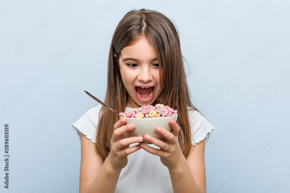 Little caucasian girl holding a cereal bowl Little caucasian girl holding a cereal bowl