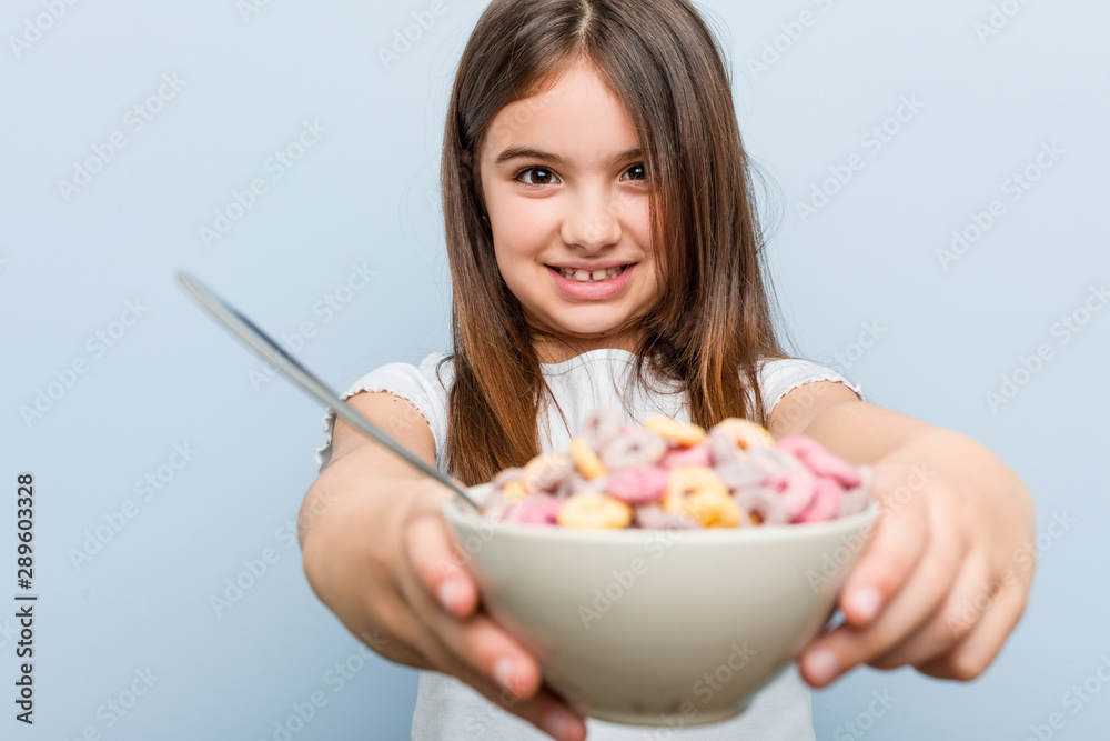 Little caucasian girl holding a cereal bowl Little caucasian girl holding a cereal bowl