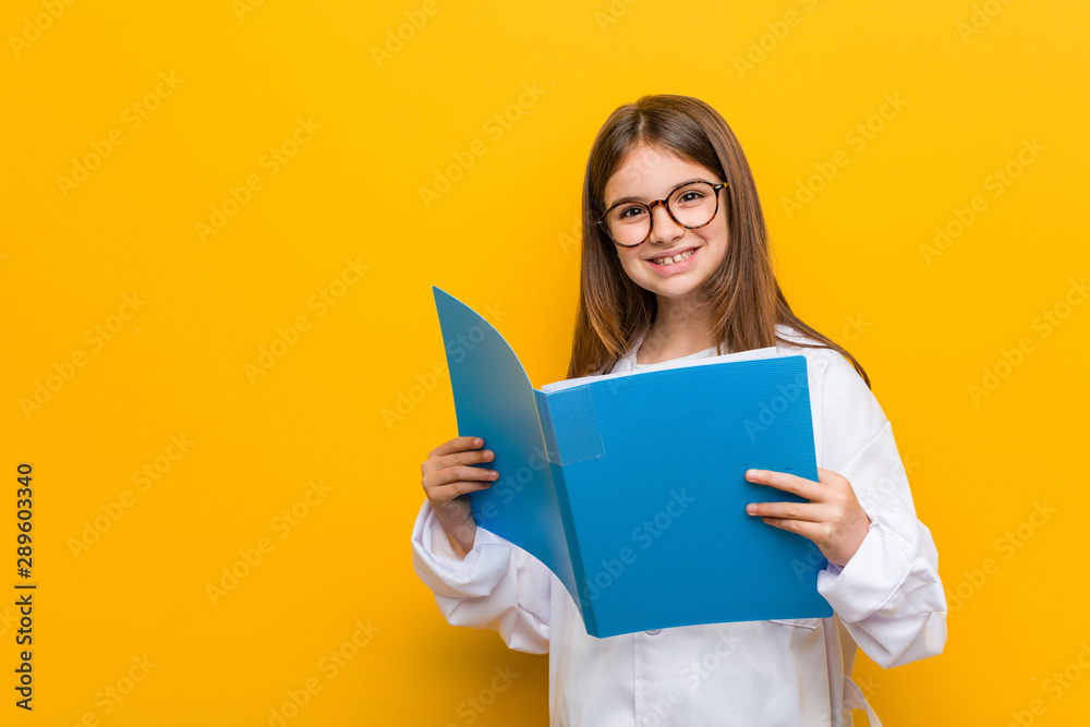 Little caucasian girl wearing a doctor costume Little caucasian girl wearing a doctor costume