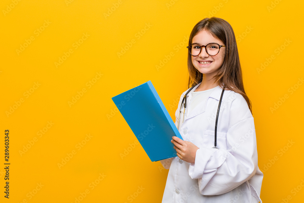 Little caucasian girl wearing a doctor costume Little caucasian girl wearing a doctor costume