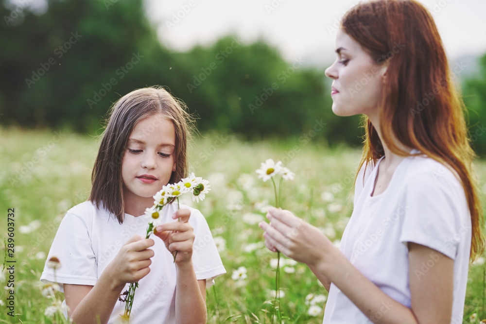 mother and daughter with flowers mother and daughter with flowers