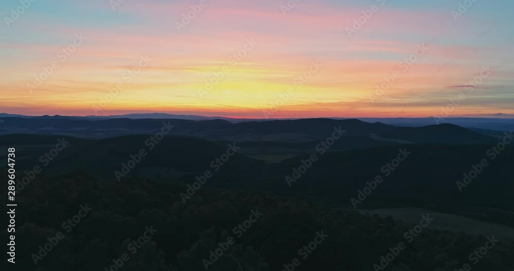 Drone view of the North Hungarian landscape of the Muzsla, part of Matra. Hills and fields of agricultural view with roads in the distance view. Hungarian town Paszto. View from the peak named Tepke. Drone view of the North Hungarian landscape of the Muzsla, part of Matra. Hills and fields of agricultural view with roads in the distance view. Hungarian town Paszto. View from the peak named Tepke.