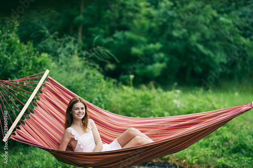 young woman relaxing in hammock