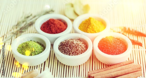 Spices and herbs in bowls. Food and cuisine ingredients.