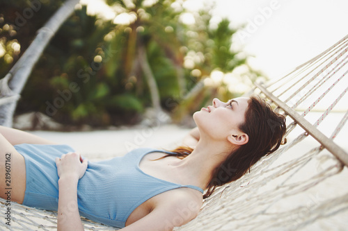 young woman relaxing in hammock © SHOTPRIME STUDIO