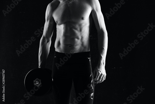 muscular man with dumbbells