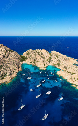 Stunning panoramic view of Cala Coticcio also known as Tahiti with its rocky coasts and small beaches bathed by a turquoise cllear water. La Maddalena Archipelago, Sardinia, Italy. photo