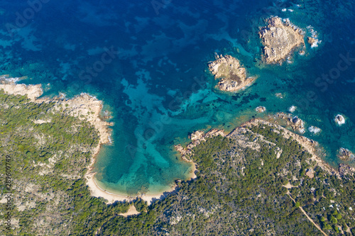 View from above, stunning aerial view of a wild beach bathed by a beautiful turquoise sea. Costa Smeralda (Emerald Coast) Sardinia, Italy. © Travel Wild