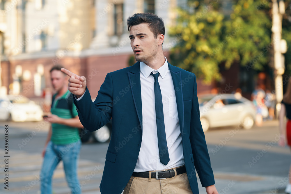 young man talking on cell phone in the city young man talking on cell phone in the city