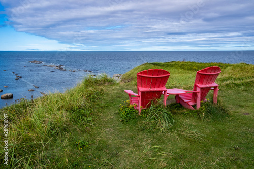 Two Red Adirondack Chairs at Green Point  Overlooking the Gulf of St. Lawrence  Newfoundland
