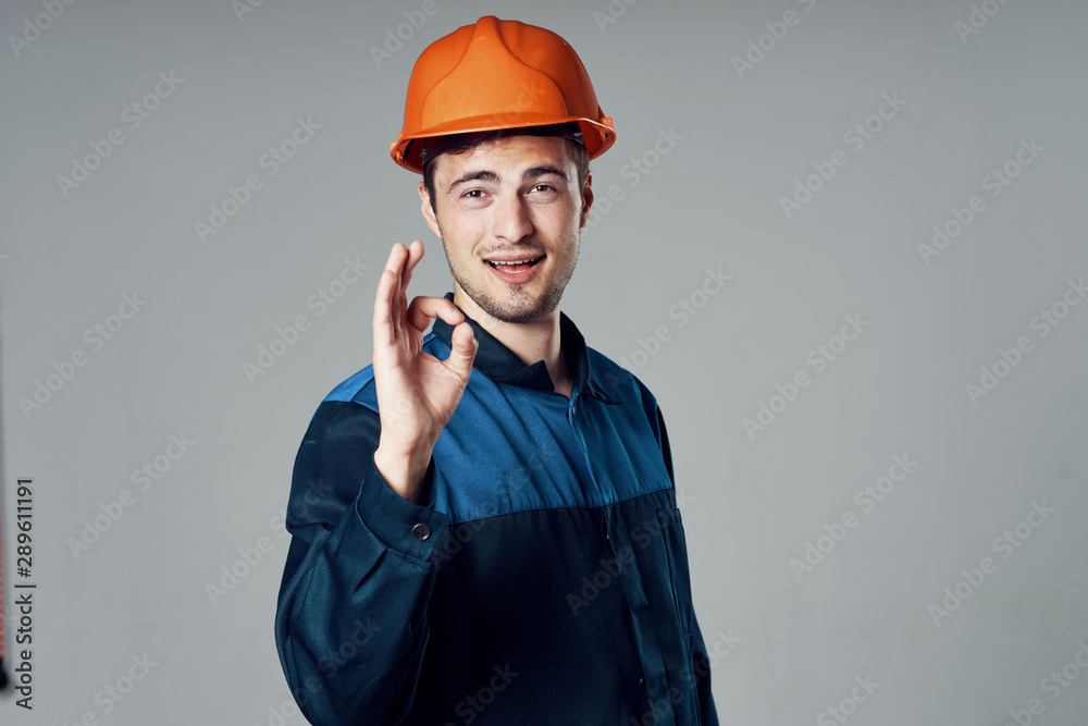 construction worker talking on cell phone construction worker talking on cell phone