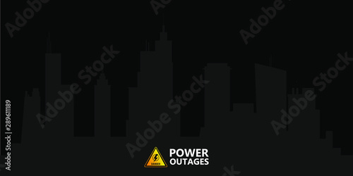 Power outage, logo on the background of the city without electricity