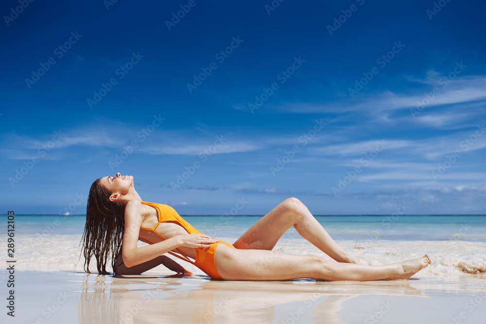woman in bikini on beach woman in bikini on beach