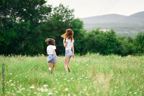 mother and daughter in the field