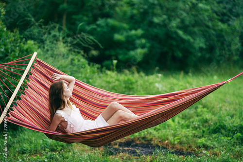 young woman relaxing in a hammock
