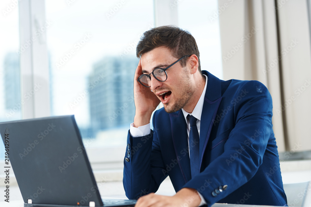 businessman talking on the phone in his office businessman talking on the phone in his office