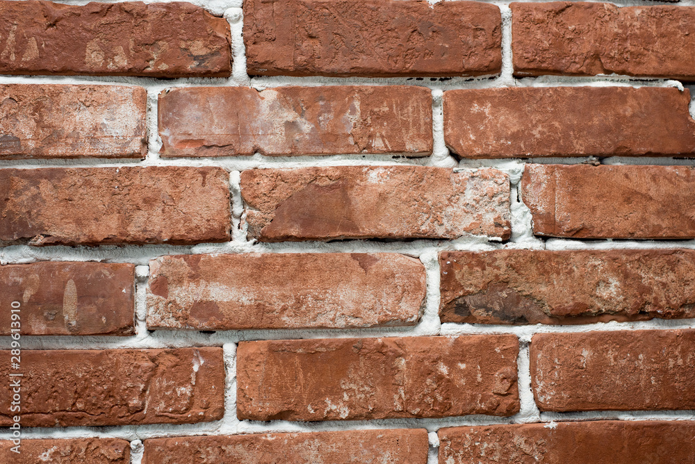 Obraz premium red and red brick wall close. Template for designers.