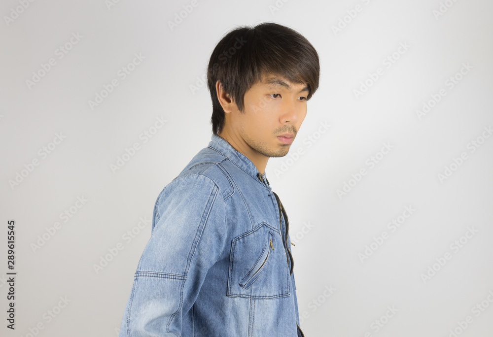 Young Asian Man in Jeans or Denim Jacket at Side View Young Asian Man in Jeans or Denim Jacket at Side View