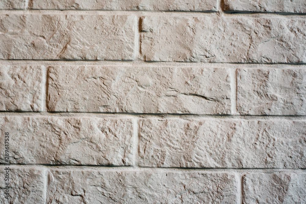 Fototapeta premium White brick vintage background. cracked old wall