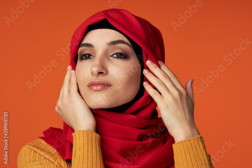 portrait of young woman in red scarf © SHOTPRIME STUDIO