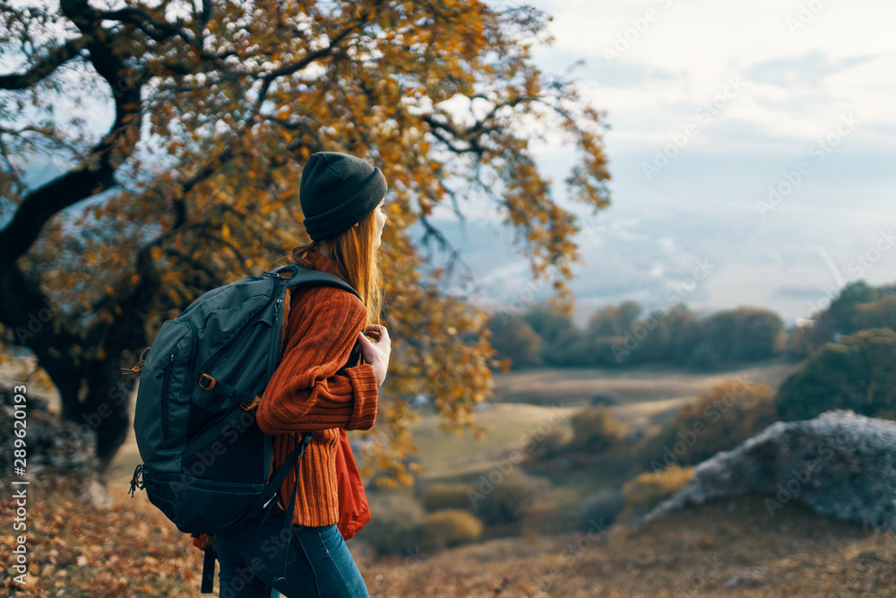 girl with backpack in mountains girl with backpack in mountains