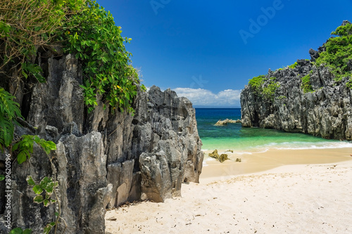 Limestone rock formation on Lahus Island beach in the municipality of Caramoan, Camarines Sur Province, Luzon in the Philippines, region for Survivor TV shows filming. photo