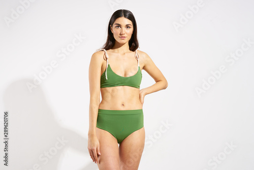 young woman in green bikini