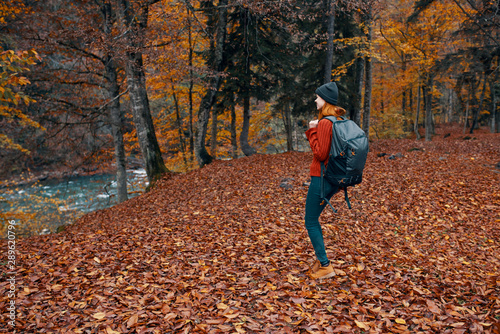 young woman walking in autumn park © SHOTPRIME STUDIO