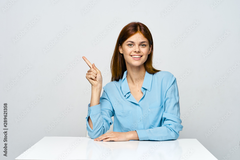 young woman writing on paper
