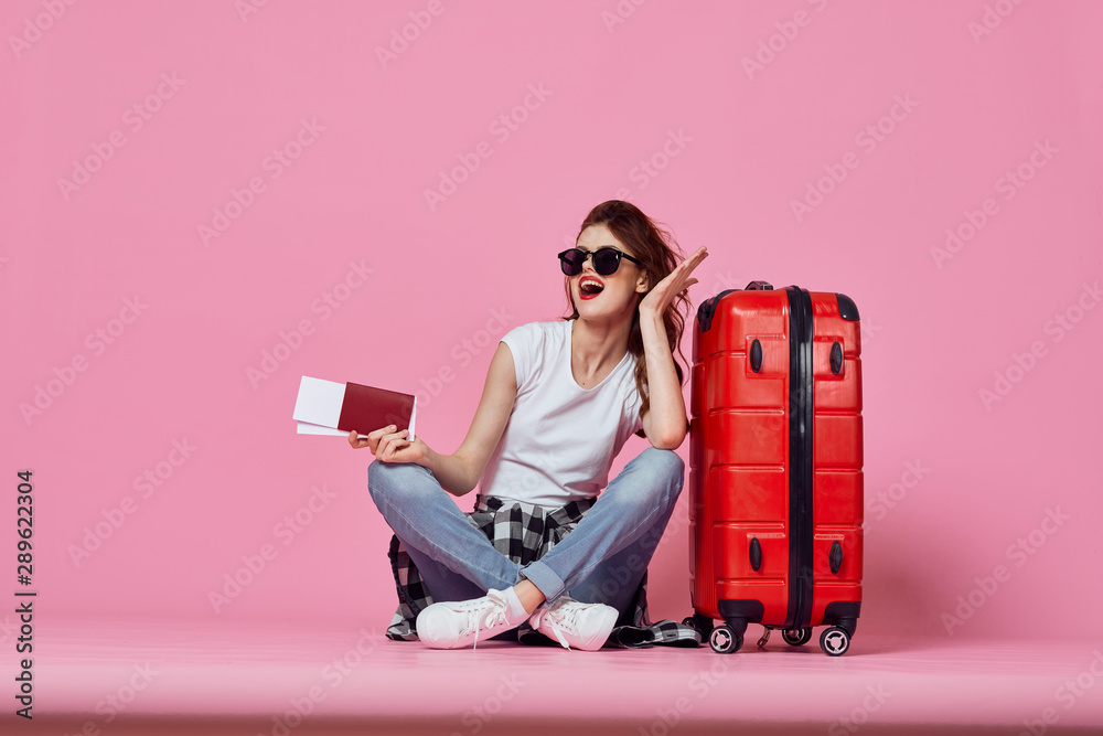 young woman with suitcase - obrazy, fototapety, plakaty 