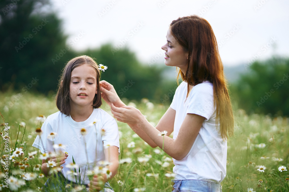 Fototapeta premium mother and daughter having fun in the park