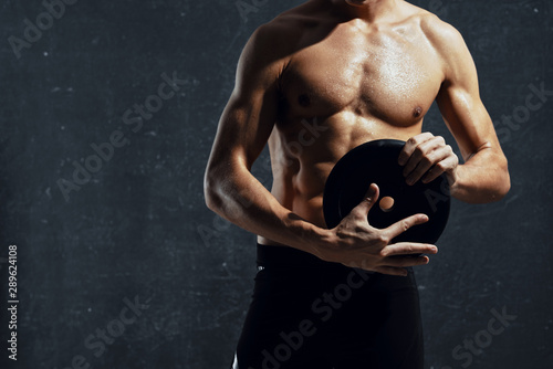 young man flexing his muscles