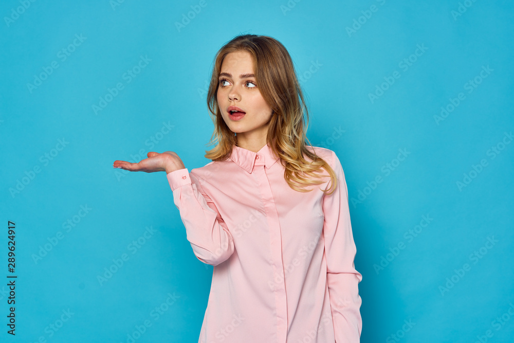 portrait of a young woman pointing at copy space portrait of a young woman pointing at copy space