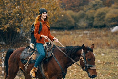 young woman riding horse