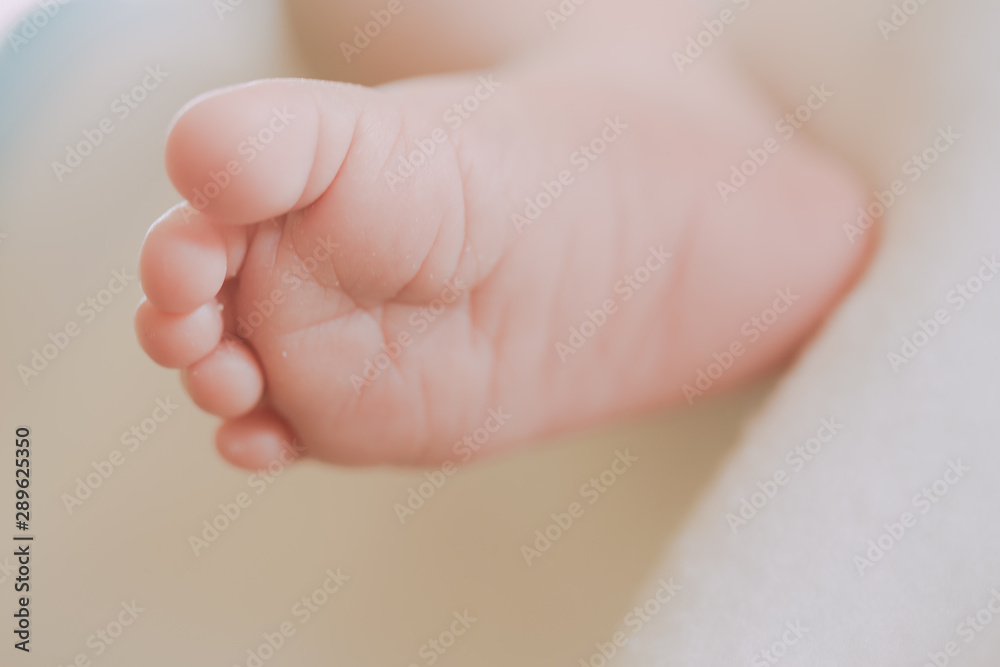 Photos closely at the foot of tiny baby Photos closely at the foot of tiny baby