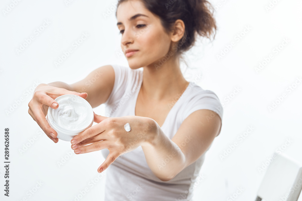 young woman with glass of water isolated on white young woman with glass of water isolated on white
