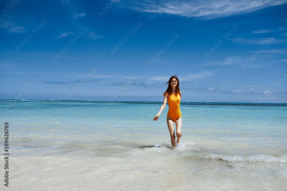 young woman running on the beach
