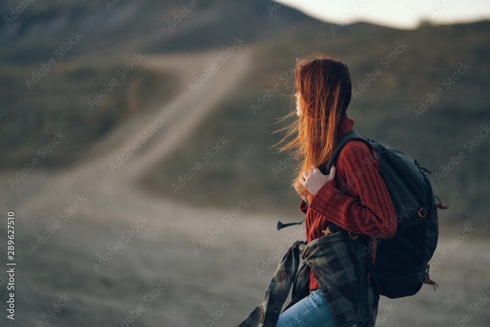 hiker with backpack standing on top of mountain hiker with backpack standing on top of mountain