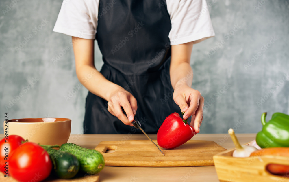 woman cutting vegetables in the kitchen